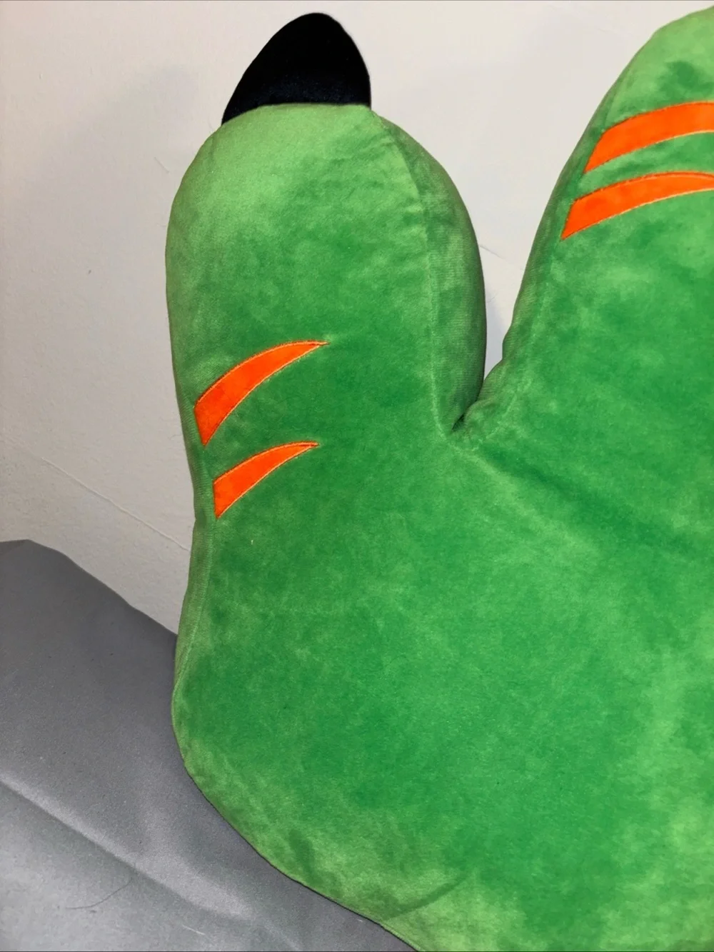 Hobby lobby green dinosaur foot throw pillow